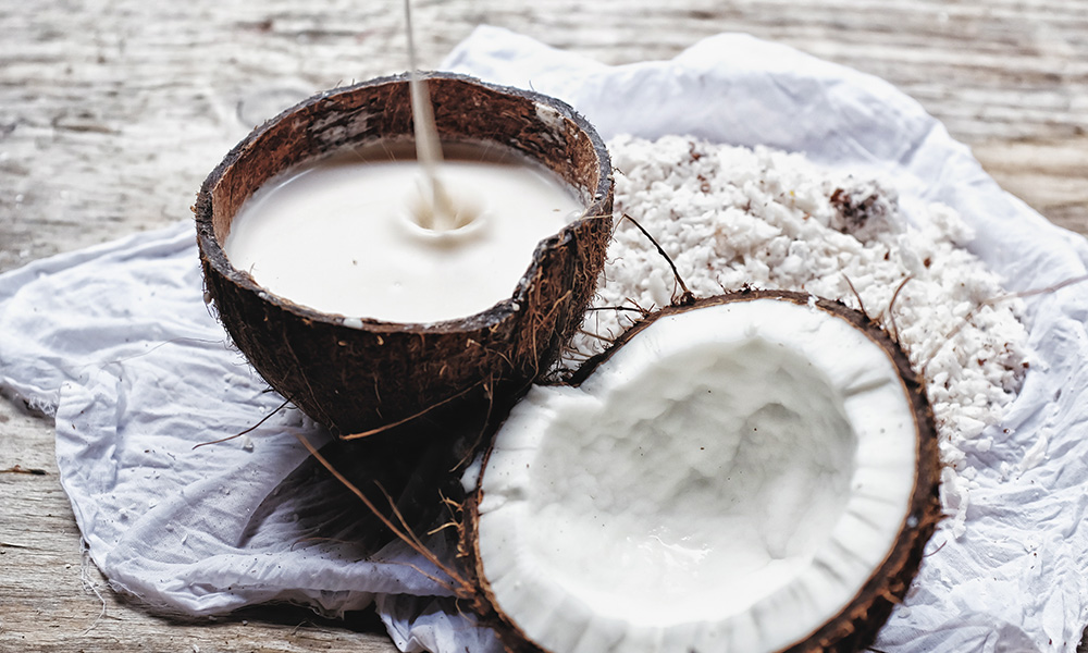 Coconut milk in a coconut, essential for Thai curries