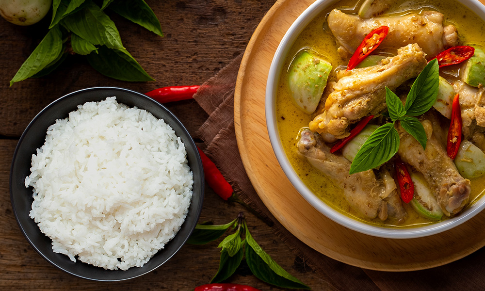 Thai Green Curry Chicken served with a bowl of jasmine rice