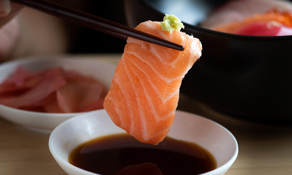 Salmon sashimi piece with wasabi