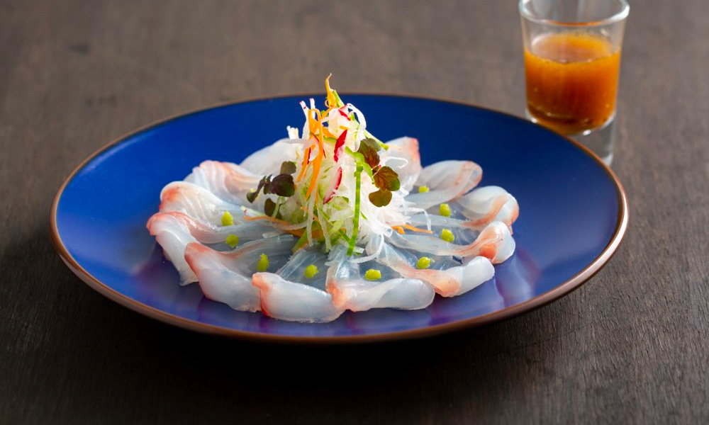 Snapper sashimi on a blue plate