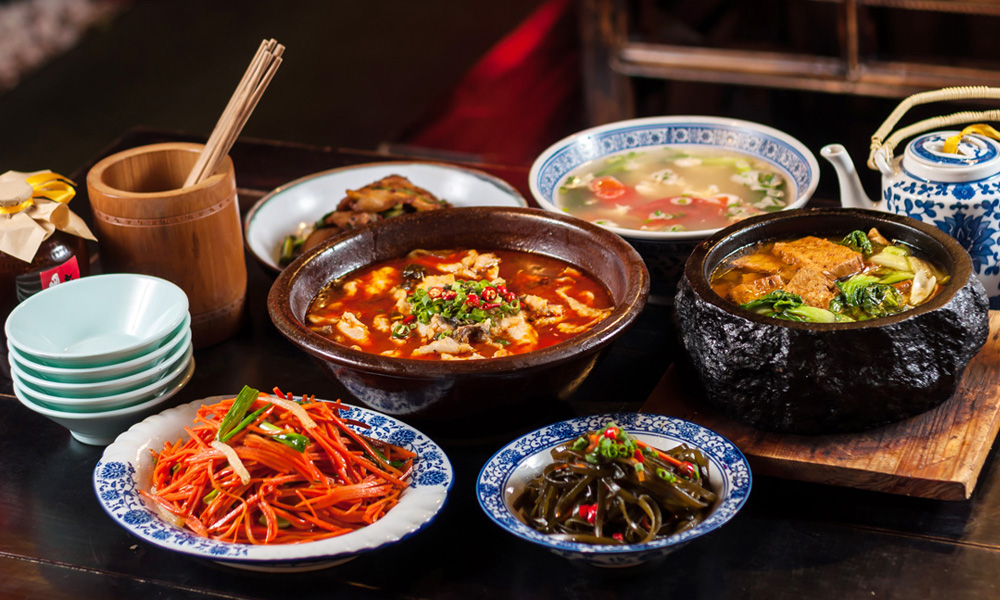 Table with Sichuan dishes