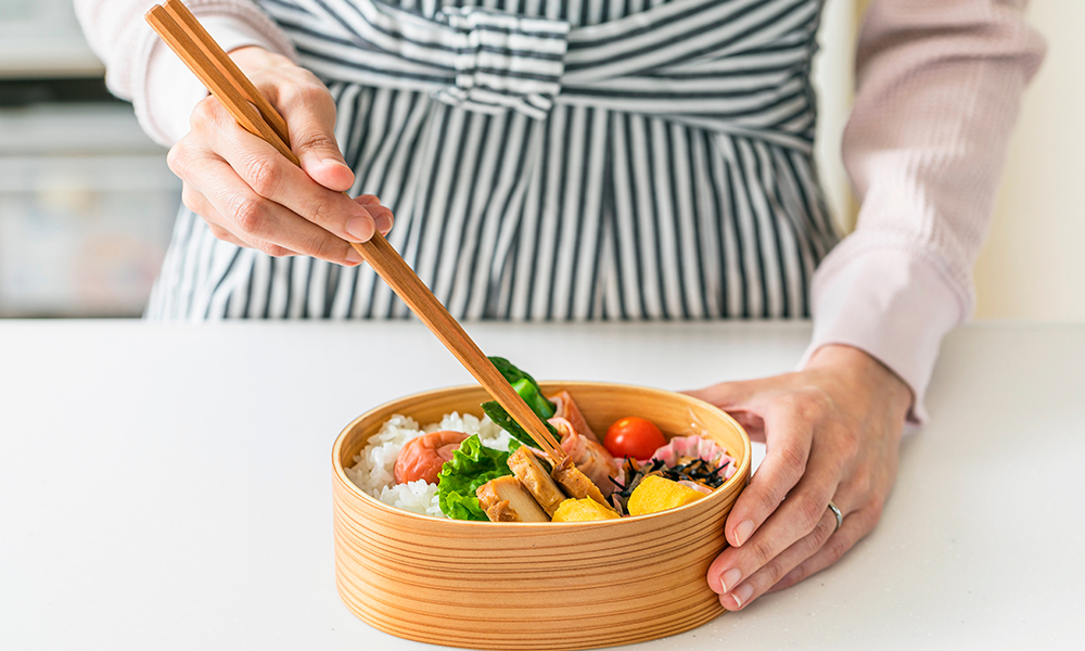 Person prepping bento box