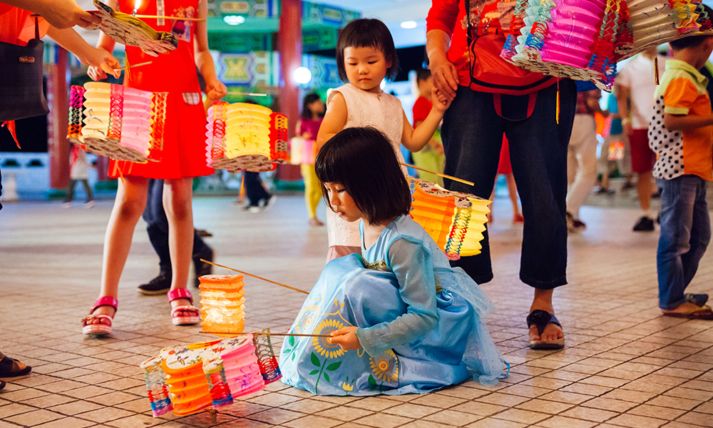 Girl holding round lantern