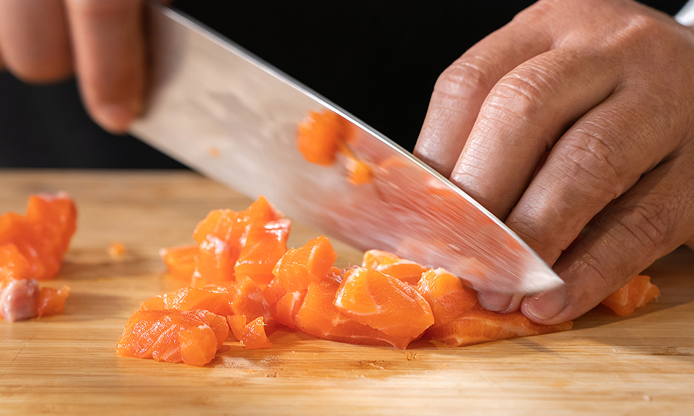 Diced sashimi fish on board