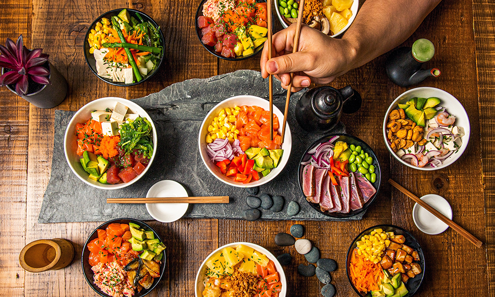 Variety of poke bowls on table