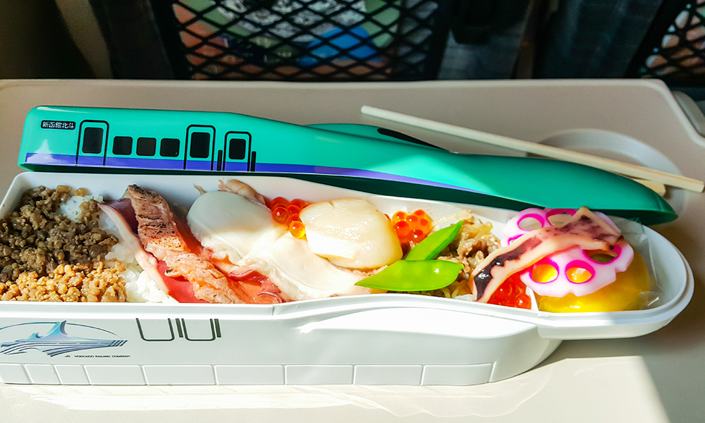 bento box in the shape of a shinkansen bullet train