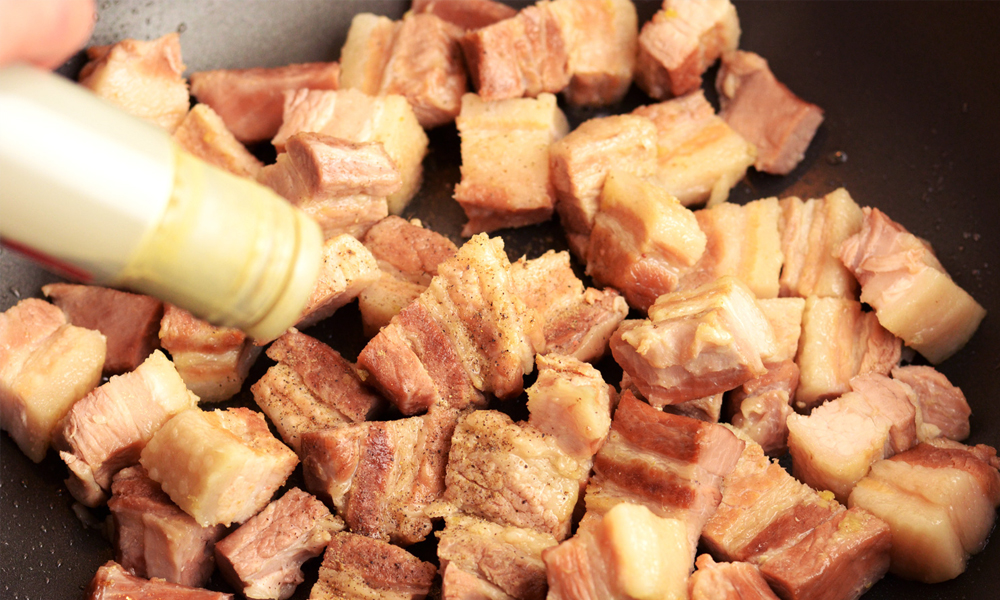 Pork belly chunks being fried