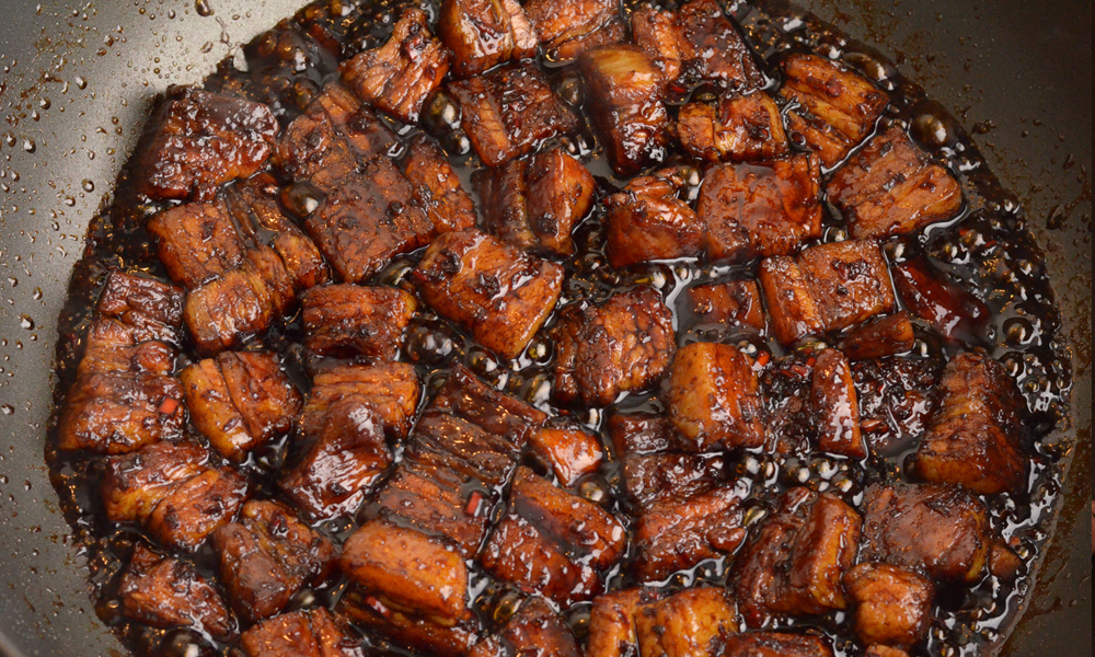 Sauce glaze added to pork belly to fry