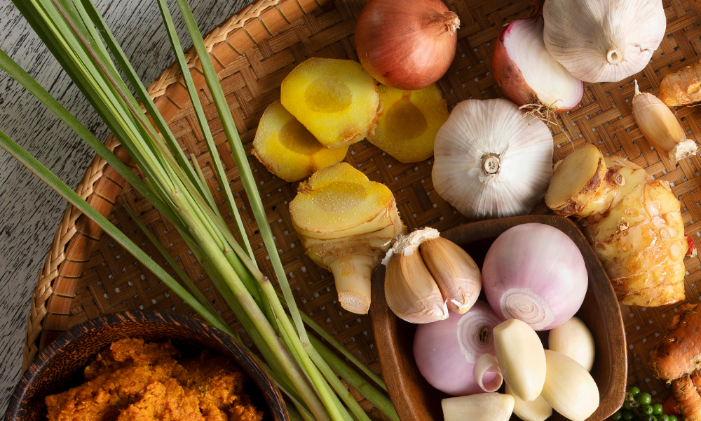 Mature ginger in a platter of various other herbs